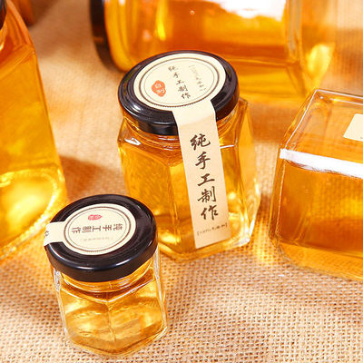 Hexagon Duidelijk glas opslagfles 100 ml 500 ml met metalen deksel voor honingroom